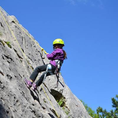 Rock Climbing child abseiling down