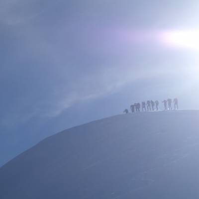 Snowshoeing group on the top of a mountain