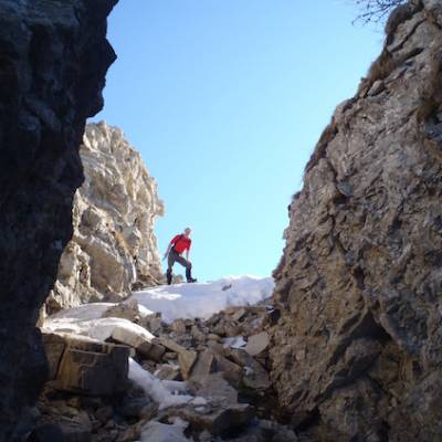 Snowshoeing in rocky outcrop in the Alps