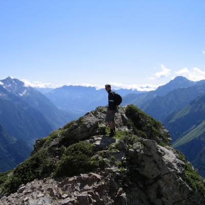 Walking in the French Alps on a rock