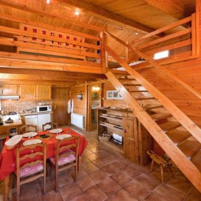 Carpe Diem Chalet view of inside with dining area and mezzanine above