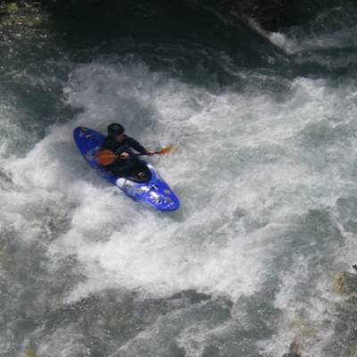 Kayaking white water rapids in the French Alps